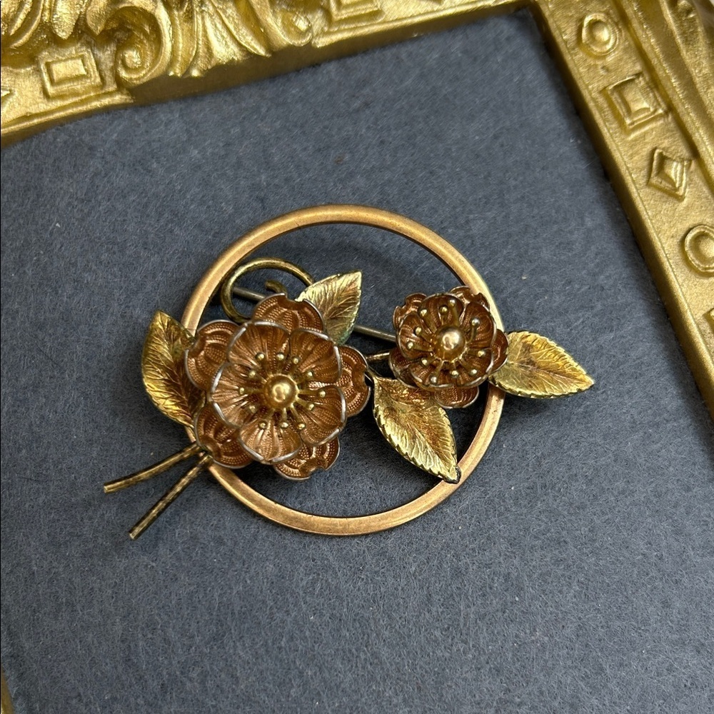 vintage Krementz brooch featuring floral designs in a mixed rose and yellow gold
